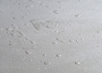 water drops on a concrete floor, microcement wet waterproof cement surface