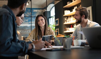 Group of young multiracial people working in modern office. Businessmen at work during meeting.