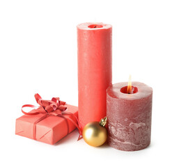 Christmas composition with aroma candles and gift box on white background