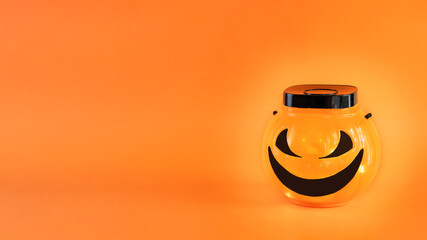 Halloween Jack-o'- Lantern Trick Or Treat Bowl with lights on orange background