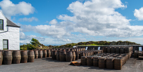 Casks and Barrels in a Whiskey distillery Islay in Scotland coast casks and barrels for Islay...