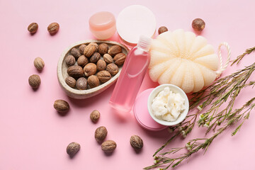 Composition with bowl of shea butter, nuts and bath supplies on color background