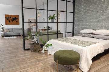 Interior of stylish bedroom with folding screen