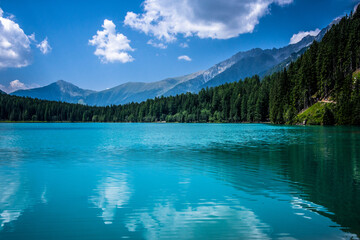 Turquoise mountain lake with blue sky