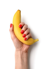 Woman with beautiful manicure holding banana on white background