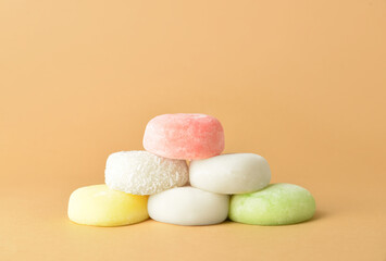 Tasty Japanese mochi on color background