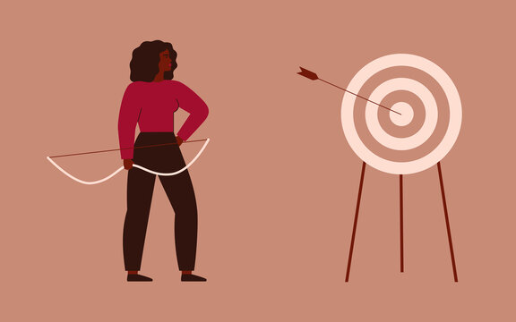 Businesswoman shooting a bow and hit a target. Archery to the bull’s-eye of the dartboard. A strong girl achieves her goals in her life and career. Concept of accuracy business strategy and victory.