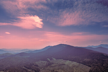 Obraz premium Mountain view against the background of the sunset sky in summer