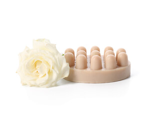 Massage soap bar and rose flower on white background