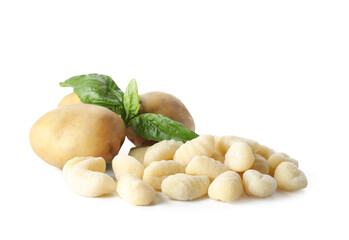 Raw gnocchi and potatoes on white background