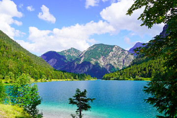 Landscape at the Plansee in Tyrol, Austria. Turquoise colored lake with surrounding landscape and mountains.