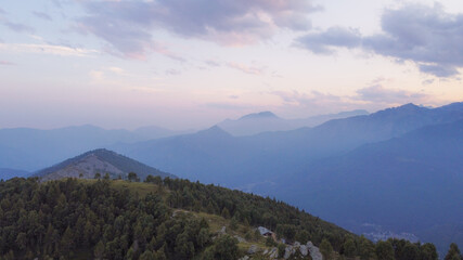 Aerial view of mountain peaks in the Italian Alps on sunset.