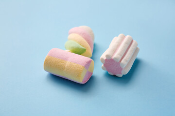 Tasty marshmallows on color background