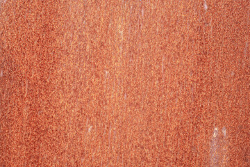 Rust on painted metal when exposed to the environment.