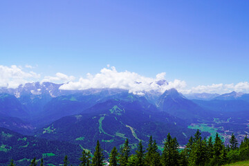Wank mountain peaks near Garmisch-Partenkirchen, Bavaria. View from above of the surrounding landscape with mountains.