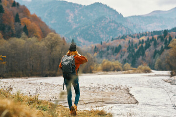 Fototapeta na wymiar woman with backpack mountain river travel lifestyle freedom
