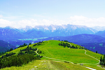 Fototapeta premium Wank mountain peaks near Garmisch-Partenkirchen, Bavaria. View from above of the surrounding landscape with mountains.