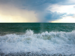 Turquoise sea with waves and foam