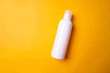 packaging of shampoo or hair rinse on a colored background