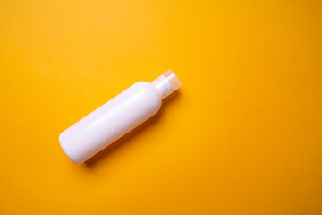 packaging of shampoo or hair rinse on a colored background