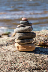 Fototapeta na wymiar Zen stones at the Baltic sea on a sunny day in September in Latvia