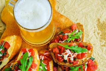 Beer drink bruschetta sausages pizza. fresh vegetable.