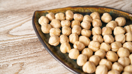 Healthy and wholesome food high in protein. Roasted peeled hazelnuts on a leaf plate