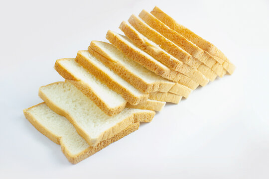 Image isolated close-up pile heap on stacked bread a slice of the bakery is food breakfast bake sliced on white background.