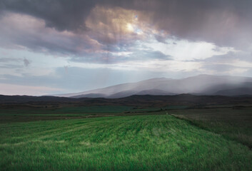 Fototapeta premium Clouds over the mountains. Landscape After Rain