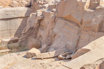 Pink granite quarry used in ancient Egypt for obelisk carving in the city of Aswan, Egypt - obrazy, fototapety, plakaty