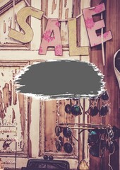 Grey banner with copy space against sale text hanging against grunge wooden background