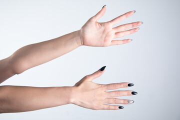 Woman hands on grey background