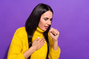 Photo of young lady hand on chest coughing in fist feeling bad isolated on violet color background