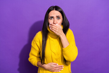 Portrait of displeased girl arm on stomach covering mouth feel bad isolated on purple color...