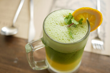 glass of lemon juice on table ,