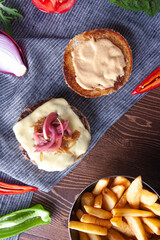 Rustic burger with melted cheese and caramelized onions.