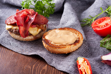 Bacon burger, caramelized onions and french fries.