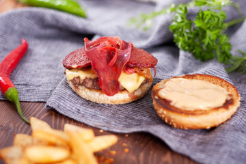 Bacon burger, caramelized onions and french fries.