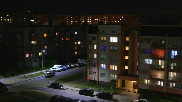 Night time lapse of Light in the windows of a multistory building