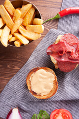 Bacon burger, caramelized onions and french fries.