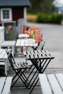 Flowers on wooden table in outdoor restaurant