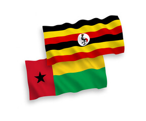 Flags of Republic of Guinea Bissau and Uganda on a white background