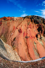 True Icelandic landscape view of colorful rainbow volcanic Landmannalaugar mountains, red and pinky volcanic crater and famous Laugavegur hiking trail at blue sky, Iceland, summer