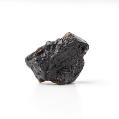 Tektite small black silikon dioxide stone of the extraterrestrial origin