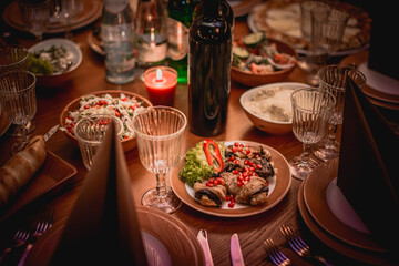 Traditional Georgian cuisine background. Khinkali, phali, chahokhbili, lobio, cheese, eggplant rolls, dark background.