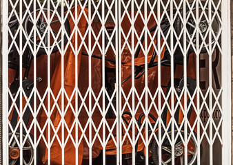 Closed white metal lattice gates