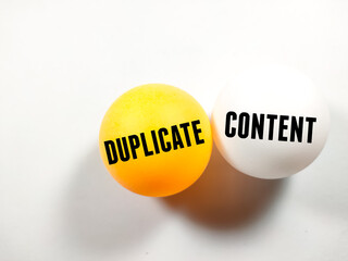 Business concept.Text DUPLICATE CONTENT writing on ping pong ball on white background.