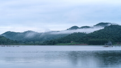 Fog in the early morning on a mountain lake Early morning.