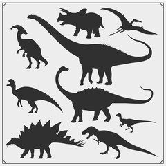 Silhouettes of dinosaurs. Vector monochrome set.