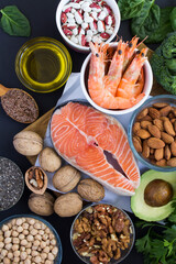Close-up on food sources of omega-3 on the black  background. Food hight in fatty acids.